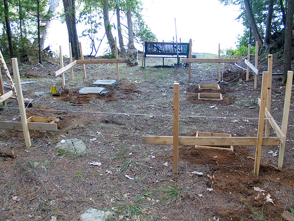 Six foundation holes dug and filled with concrete.